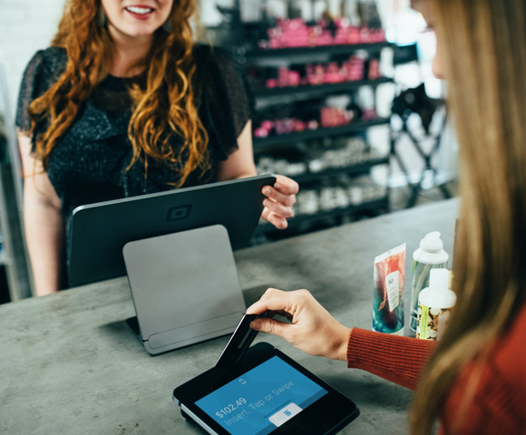 woman holding magnetic card - Photo by Blake Wisz on Unsplash